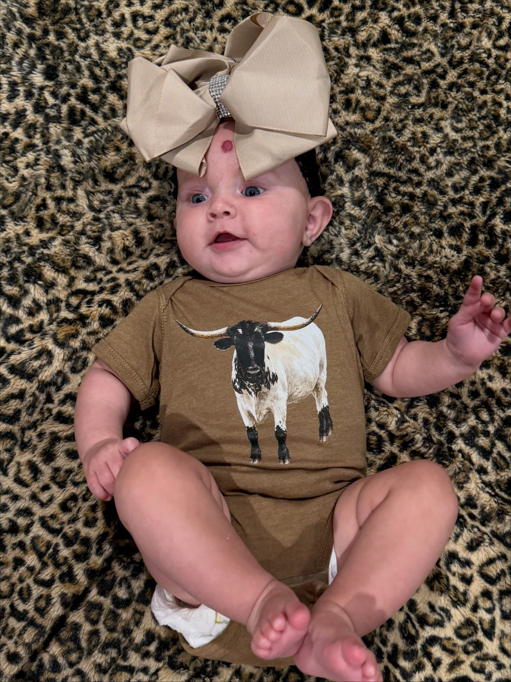Finn the Longhorn Baby Bodysuit on Vintage Coyote Brown